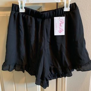 Black dressy. Ruffled shorts. New w/tags. SM